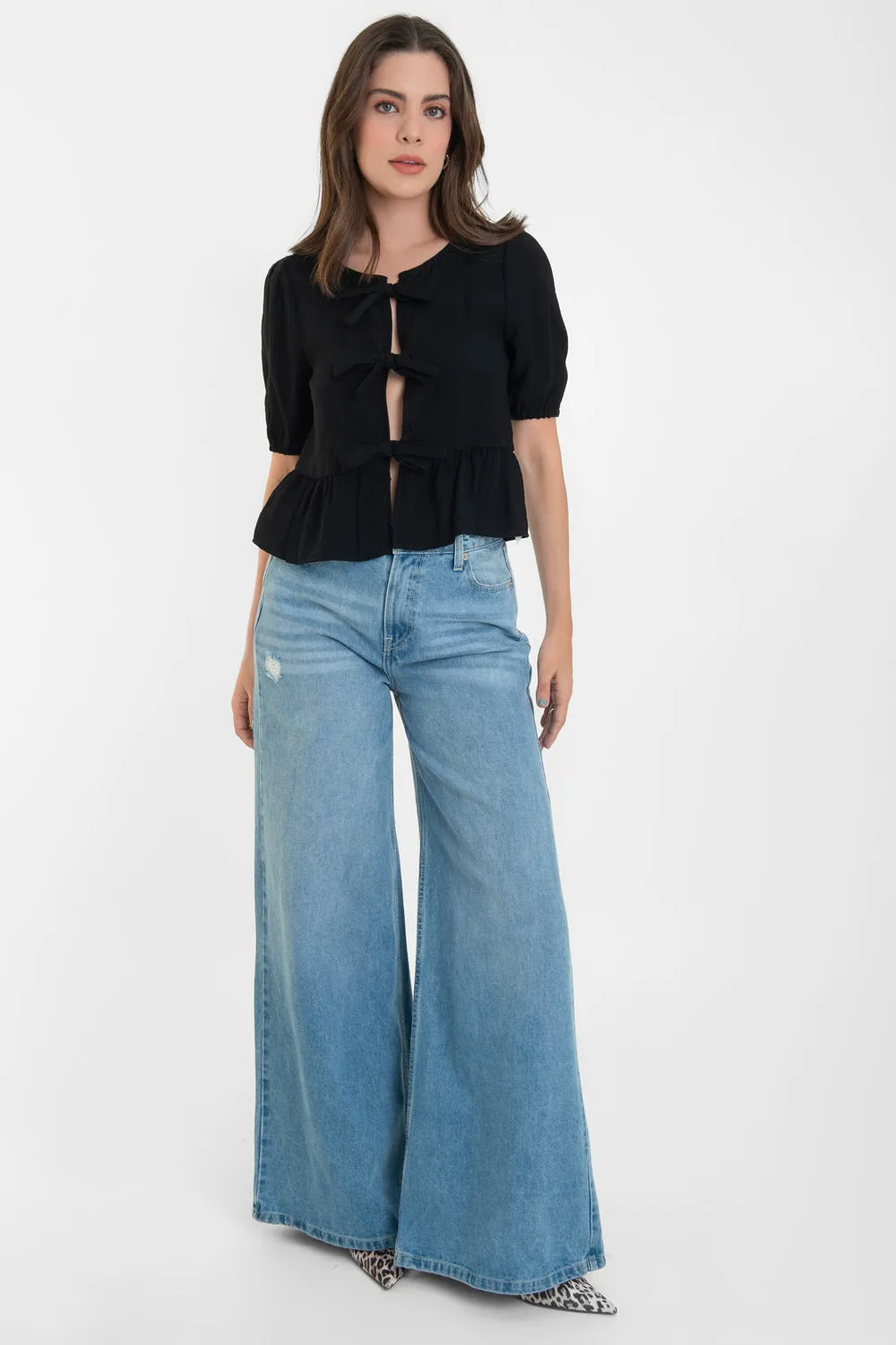 Blusa de cuello redondo con lazos peplum olanes