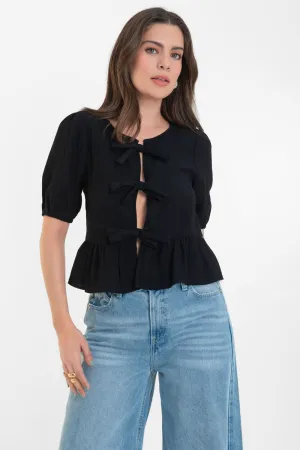 Blusa de cuello redondo con lazos peplum olanes