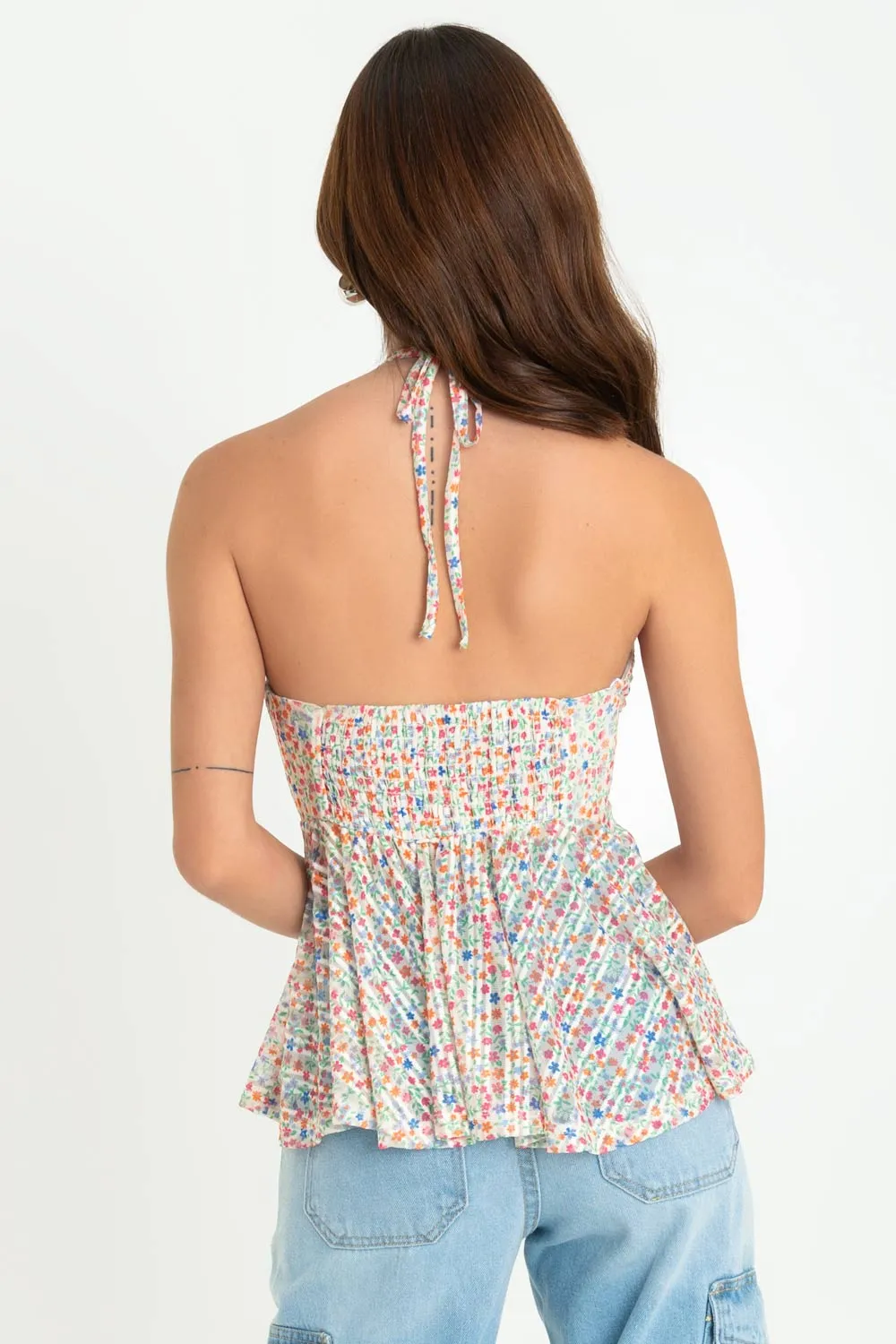 Top floral de mesh peplum con olanes